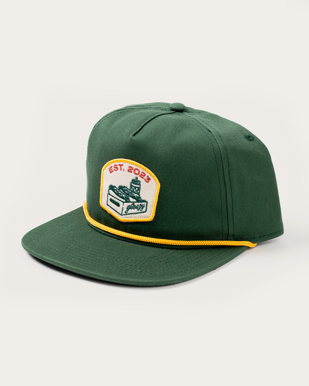 Green rope snapback hat with a cream patch showing the Gleezy hot dog box logo and 'Est. 2023'